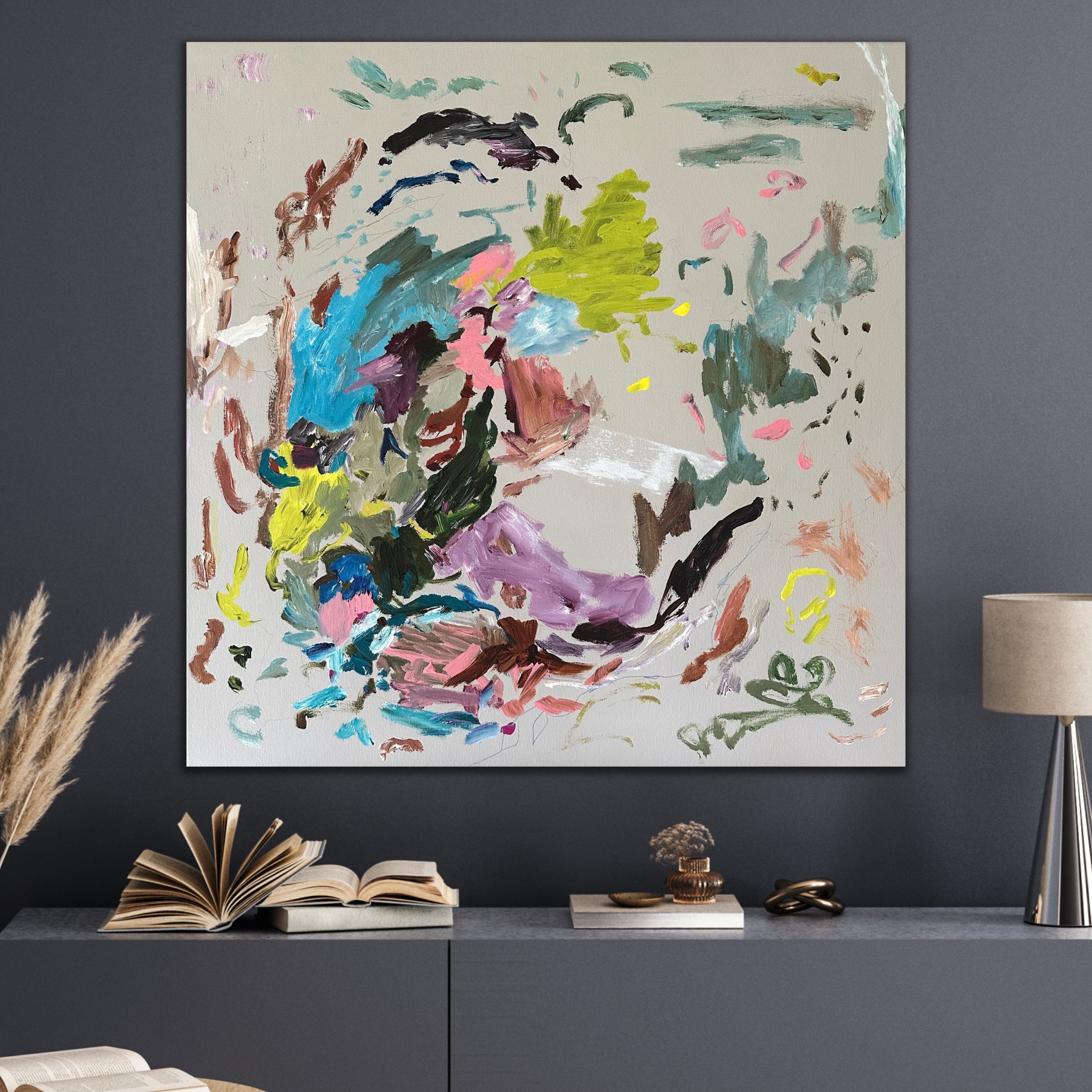 Wild, colourful abstract painting on canvas hanging on wall in contemporary living room with dark, moody feel