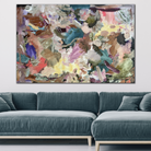 Oversize abstract artwork hanging on wall above sofa in modern living room