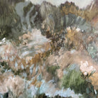 Close up detail of a landscape painting with gestural brushstrokes in natural earthy colours of green, blue, brown and white