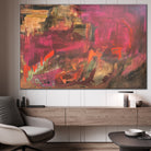 Modern abstract expressionist painting in warm colour tones hanging on wall of contemporary living space