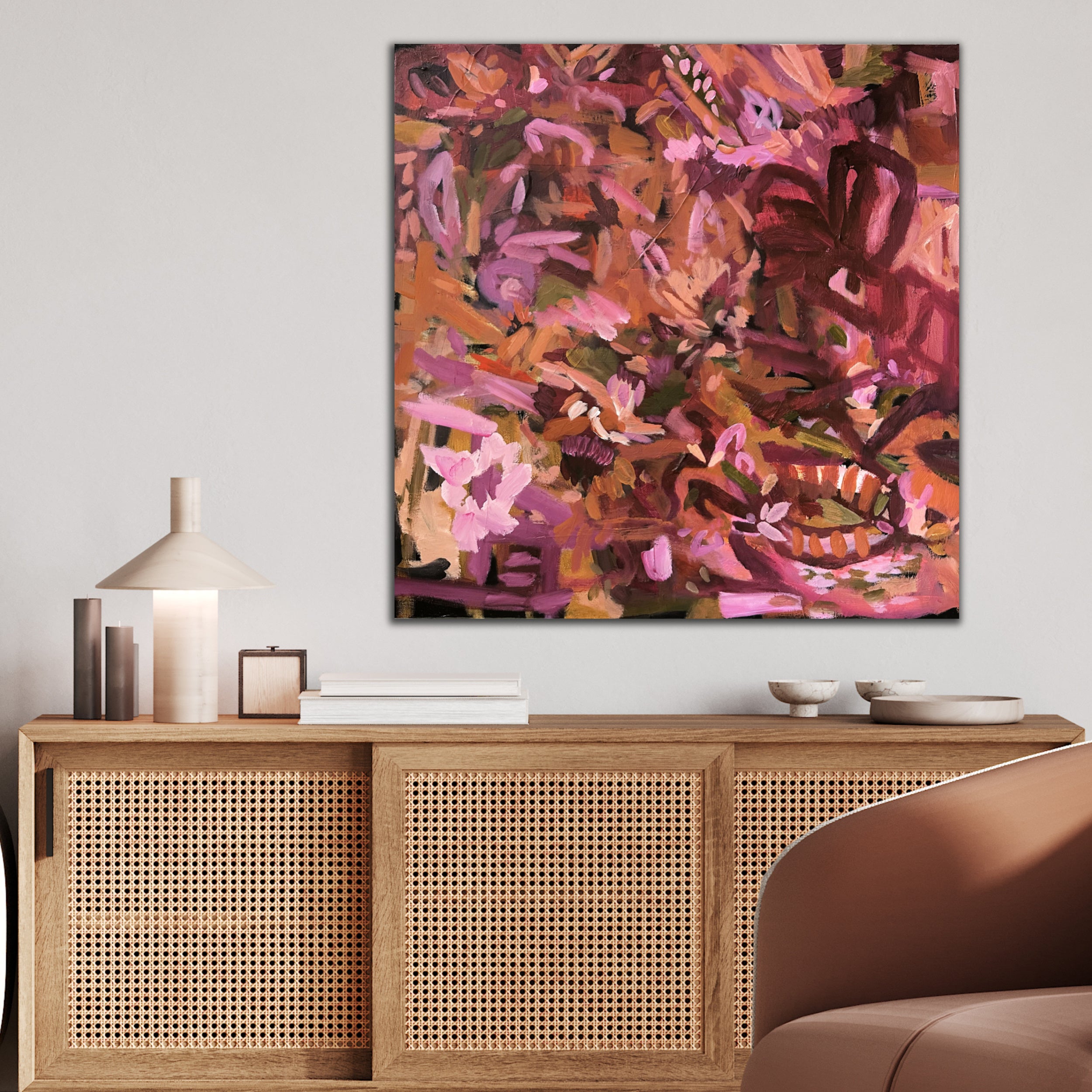 Floral painting in abstract expressionist style hanging on wall in modern neutral interior