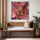 Burgundy, peach and pink abstract painting "She Loved Flowers" hanging on wall in casual home interior