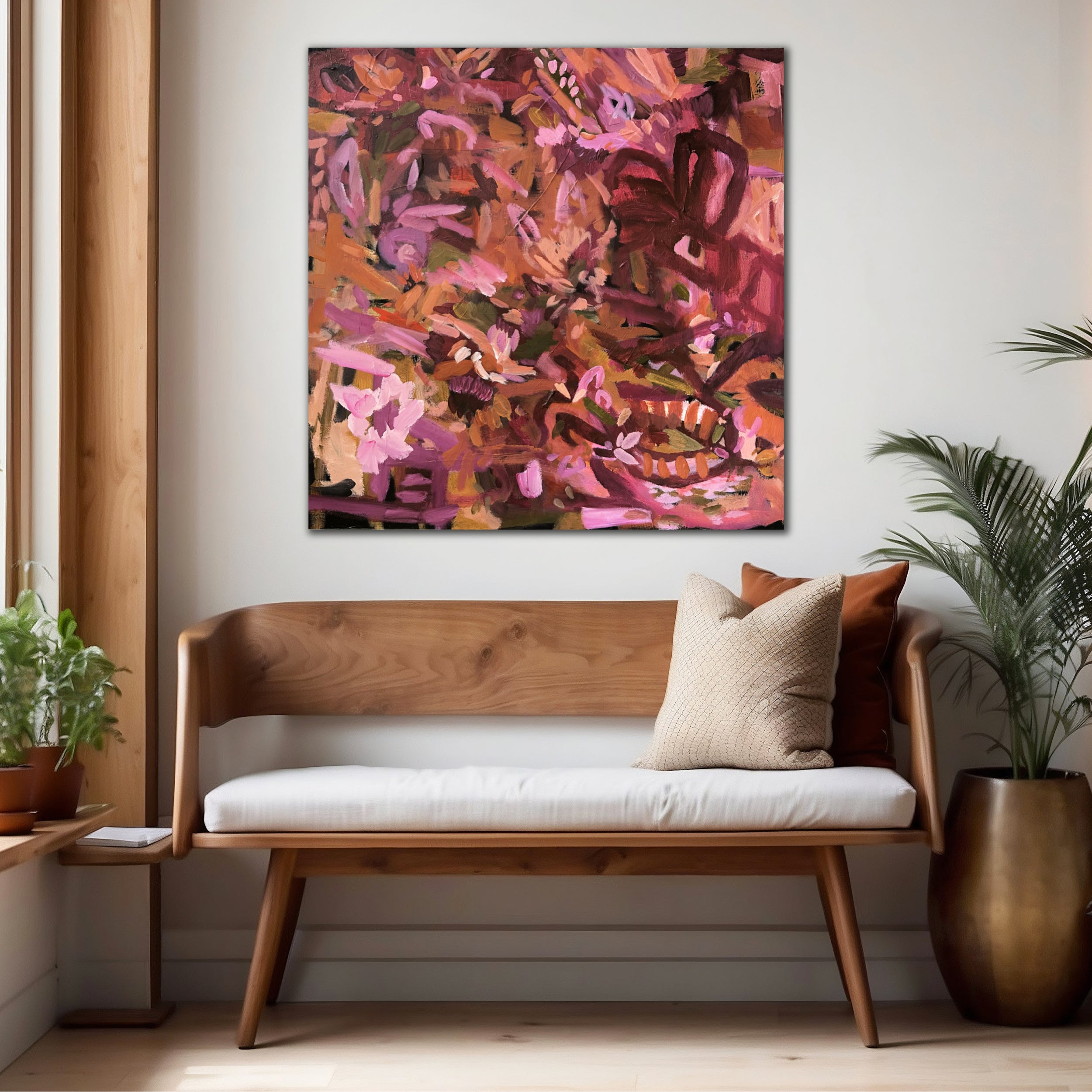 Burgundy, peach and pink abstract painting "She Loved Flowers" hanging on wall in casual home interior