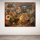 Abstract painting with earthy tones on a white wall