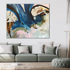 Contemporary abstract painting  in blue, black, and neutral tones hanging on wall in modern living room 