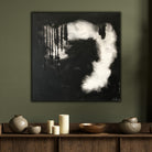 Square, black and white abstract painting hanging on wall of moody home interior - modern home interior view