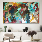 Large abstract painting in bold colours with great energy that evokes happiness - hanging on wall in home with mid-century modern furnishings