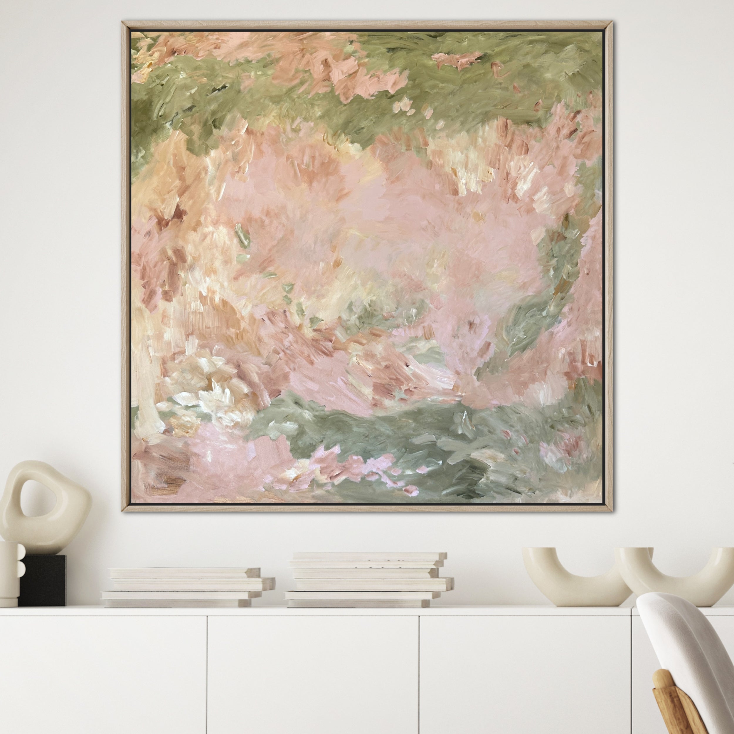 Expressive, large abstract painting in wooden frame hanging in modern, white interior 